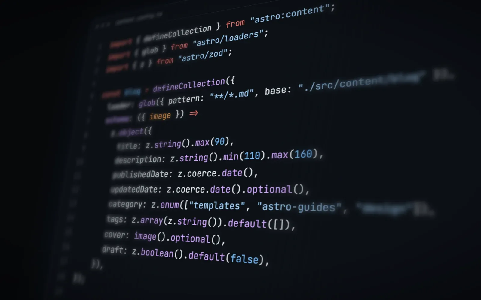 An Astro content collection schema open in a dark code editor, seen at an angle with the edges out of focus.